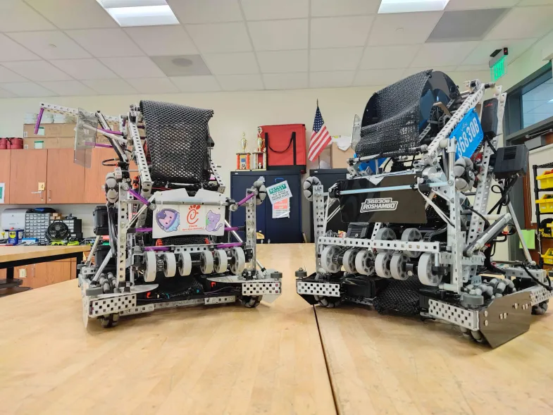Two robots on a table in the robotics lab